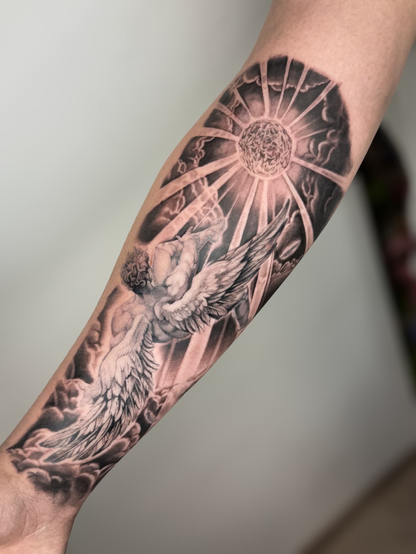 Cherub & Sunburst — Realism · Black & Grey tattoo by Ana at Blasian Ink
